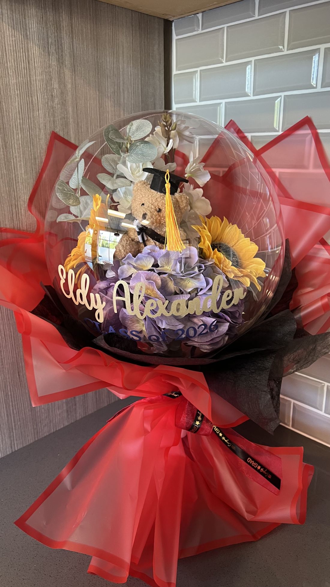 Red graduation bobo balloon with sunflowers